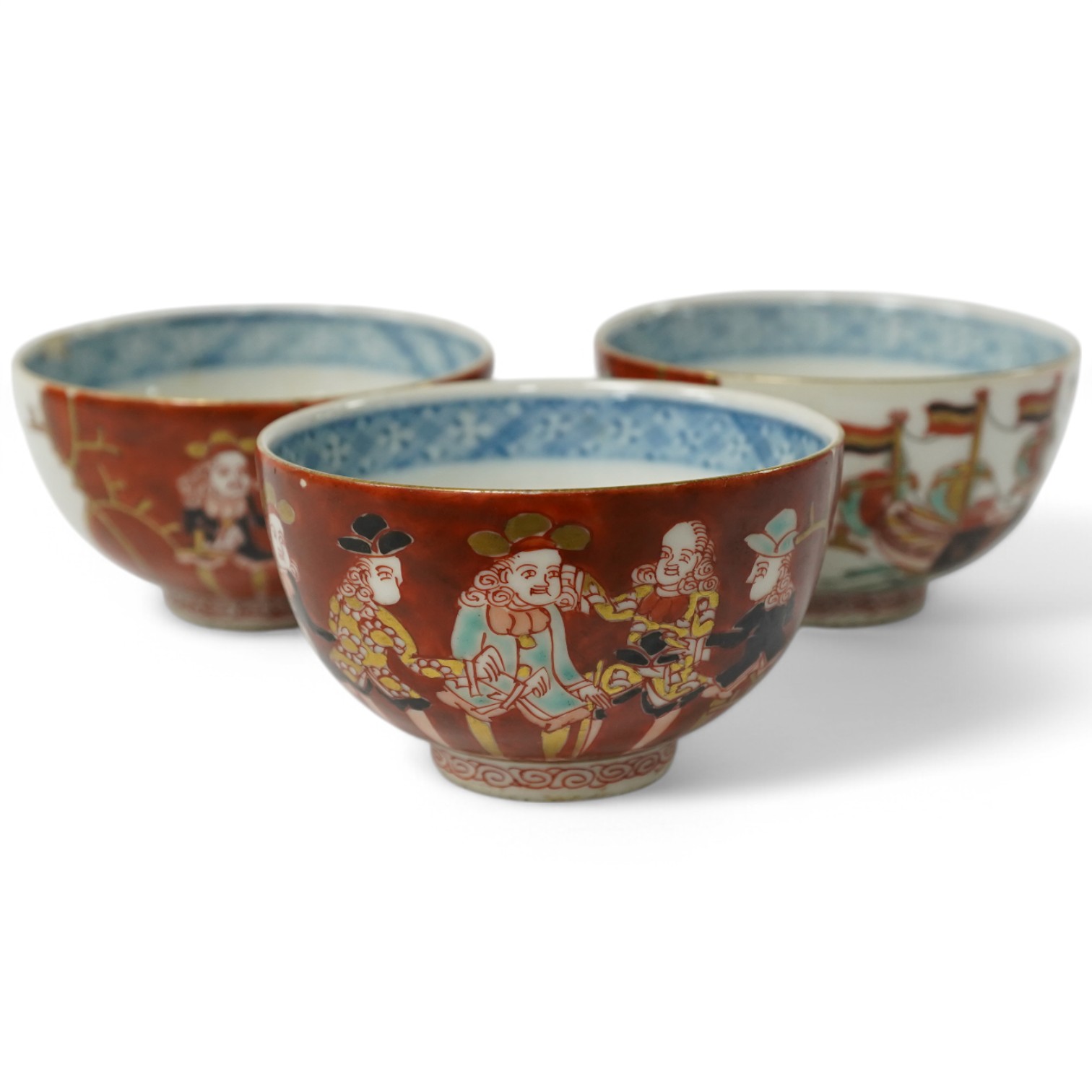 Three Imari ‘Black Ship’ teabowls, Meiji period, 8.5cm in diameter. Condition - good